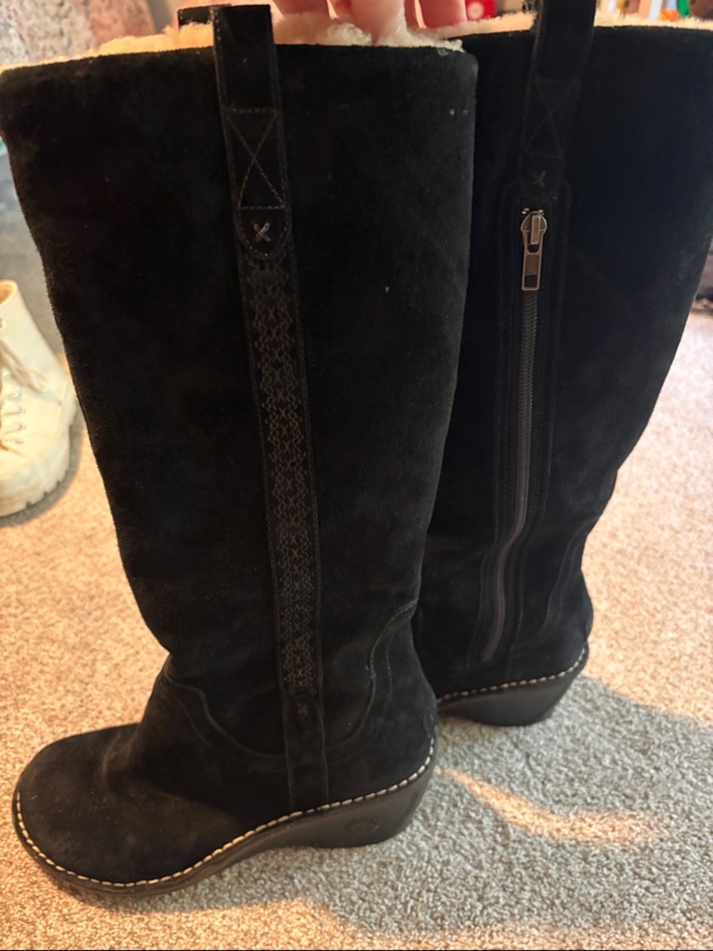 Women's Black Ugg boots.